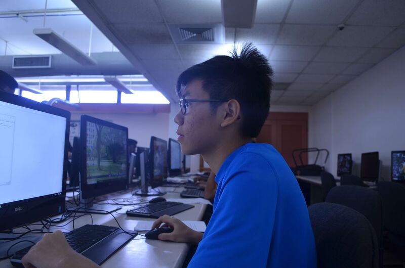 Student fully focused on coding.