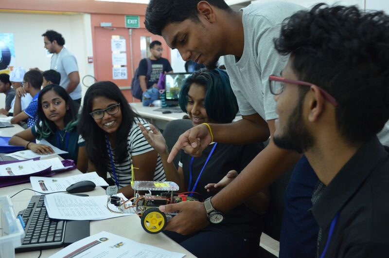 Mentor, Sanjay Santookee demonstrating parts of the bot.